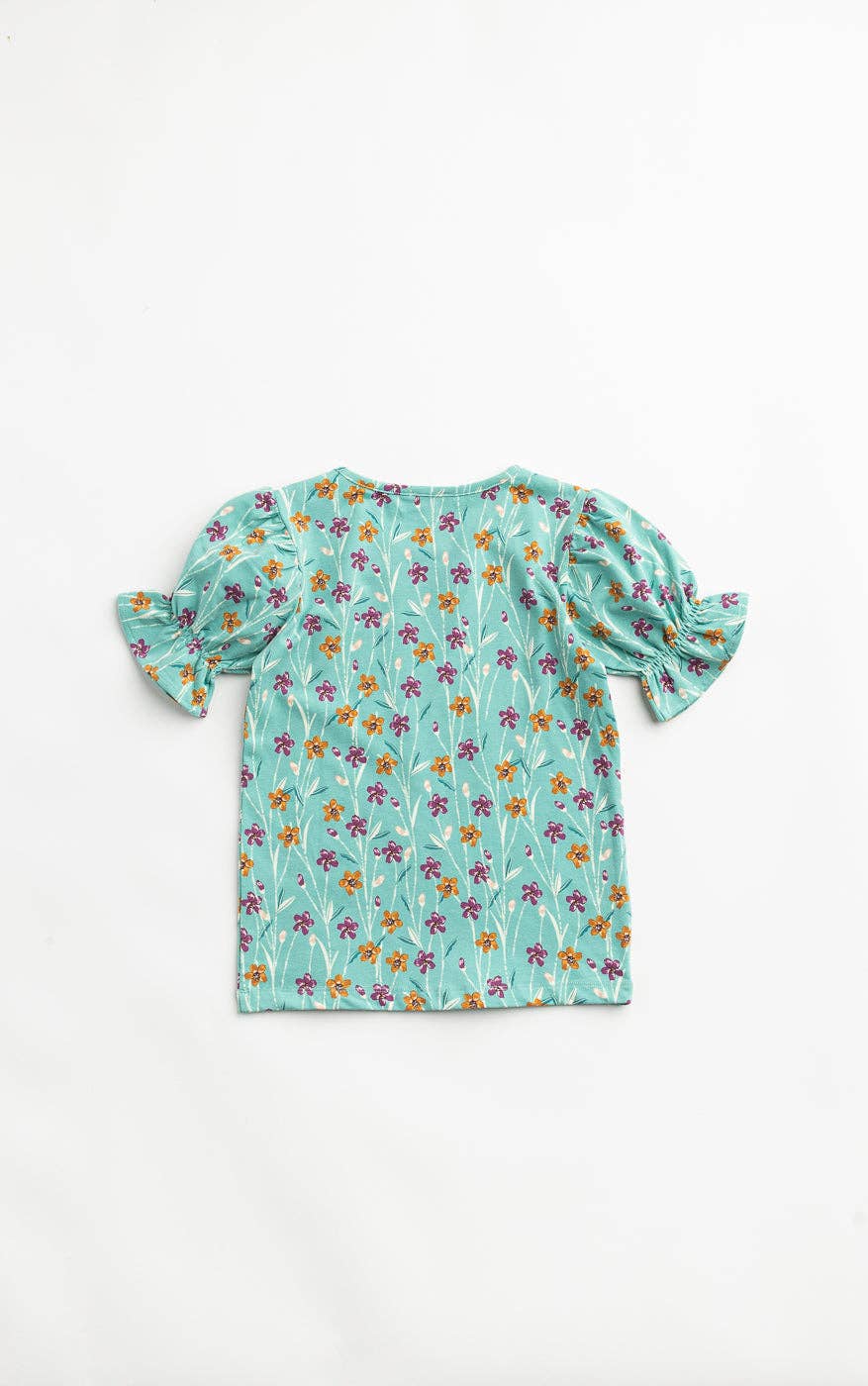 Floral-patterned top on a white background