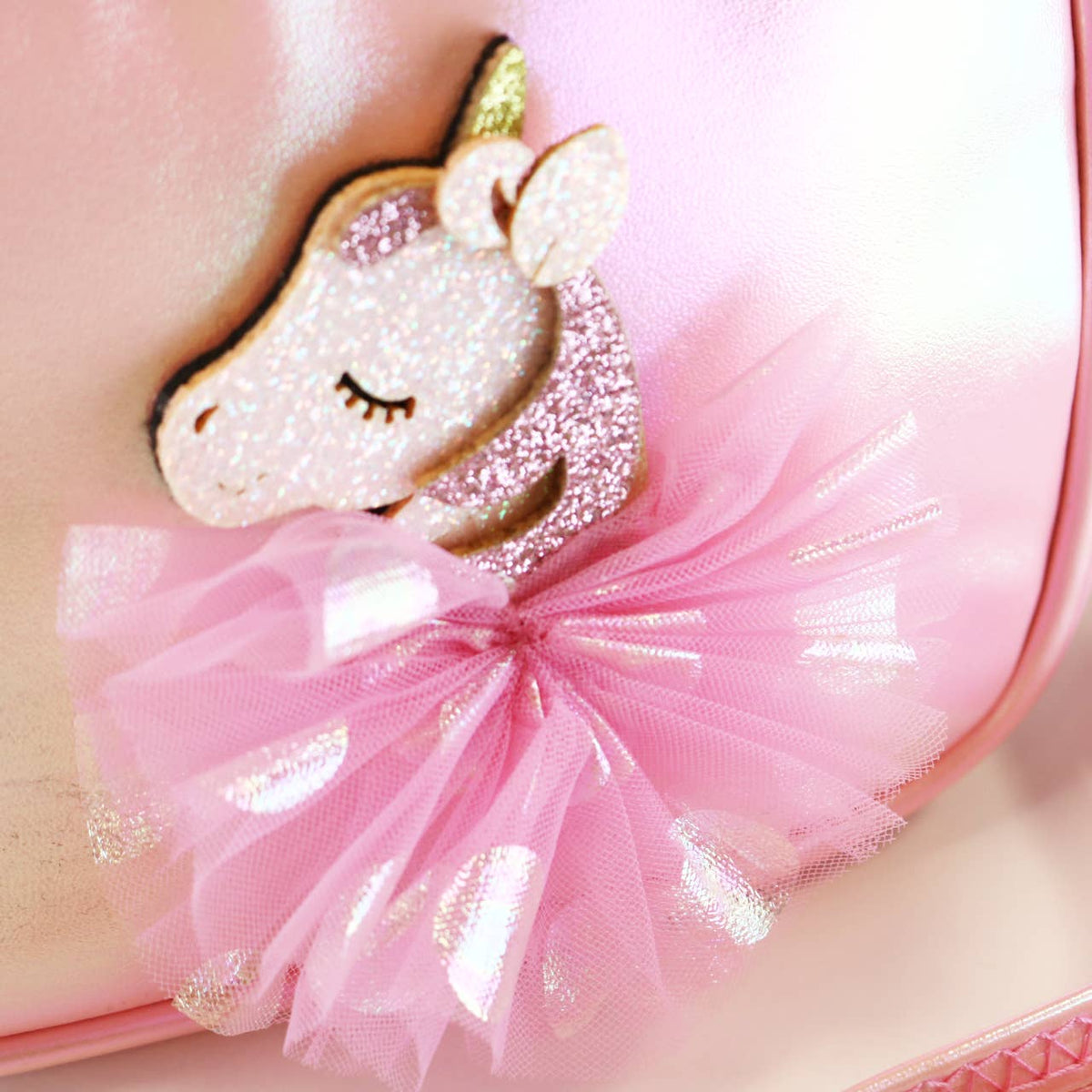 Unicorn-shaped with pink tulle on a pink background