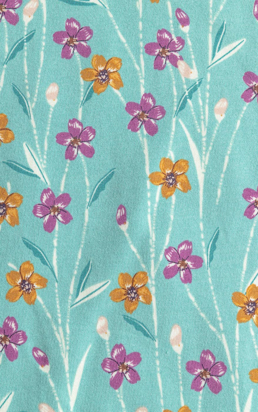 Floral pattern with purple and orange flowers on a teal background