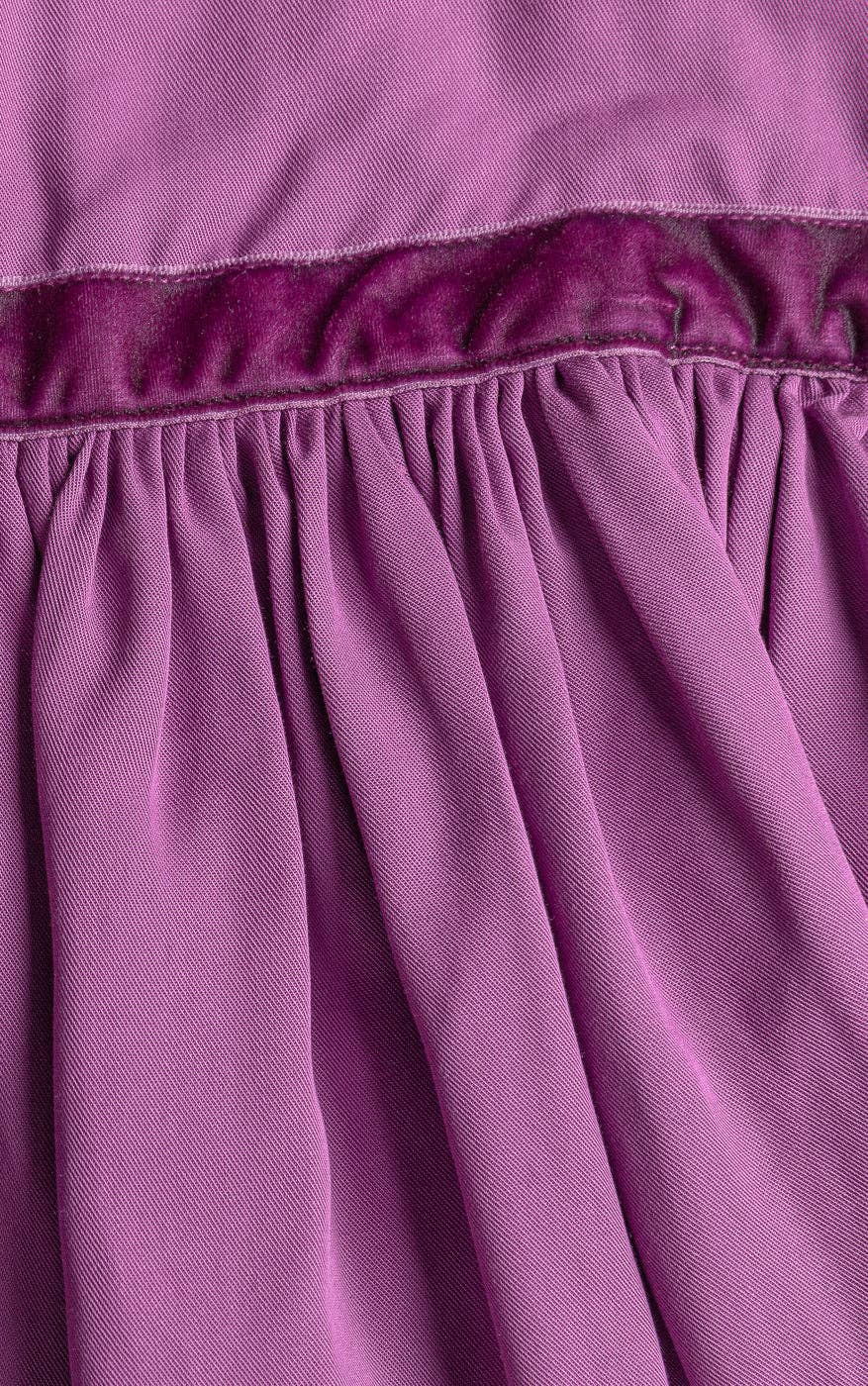 Close-up of a purple fabric with a textured texture