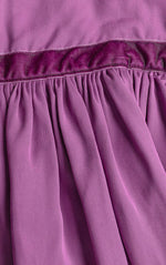 Close-up of a purple fabric with a textured texture