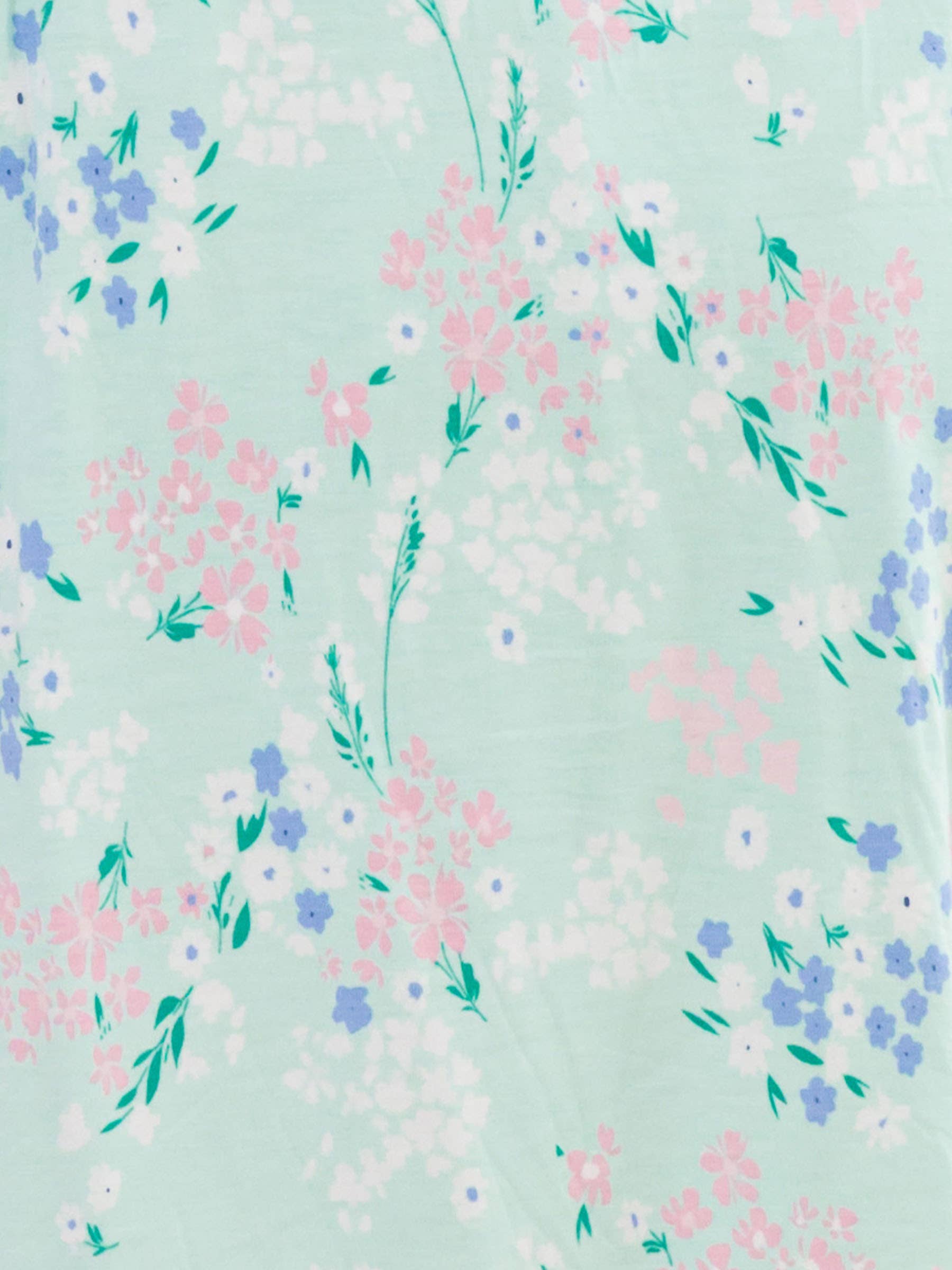 Pastel floral pattern on a light green background