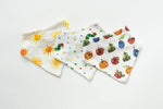 Set of three baby bibs with colorful prints on a white background