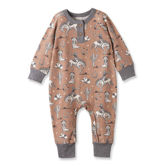 Baby onesie with cowboy and desert pattern on a white background
