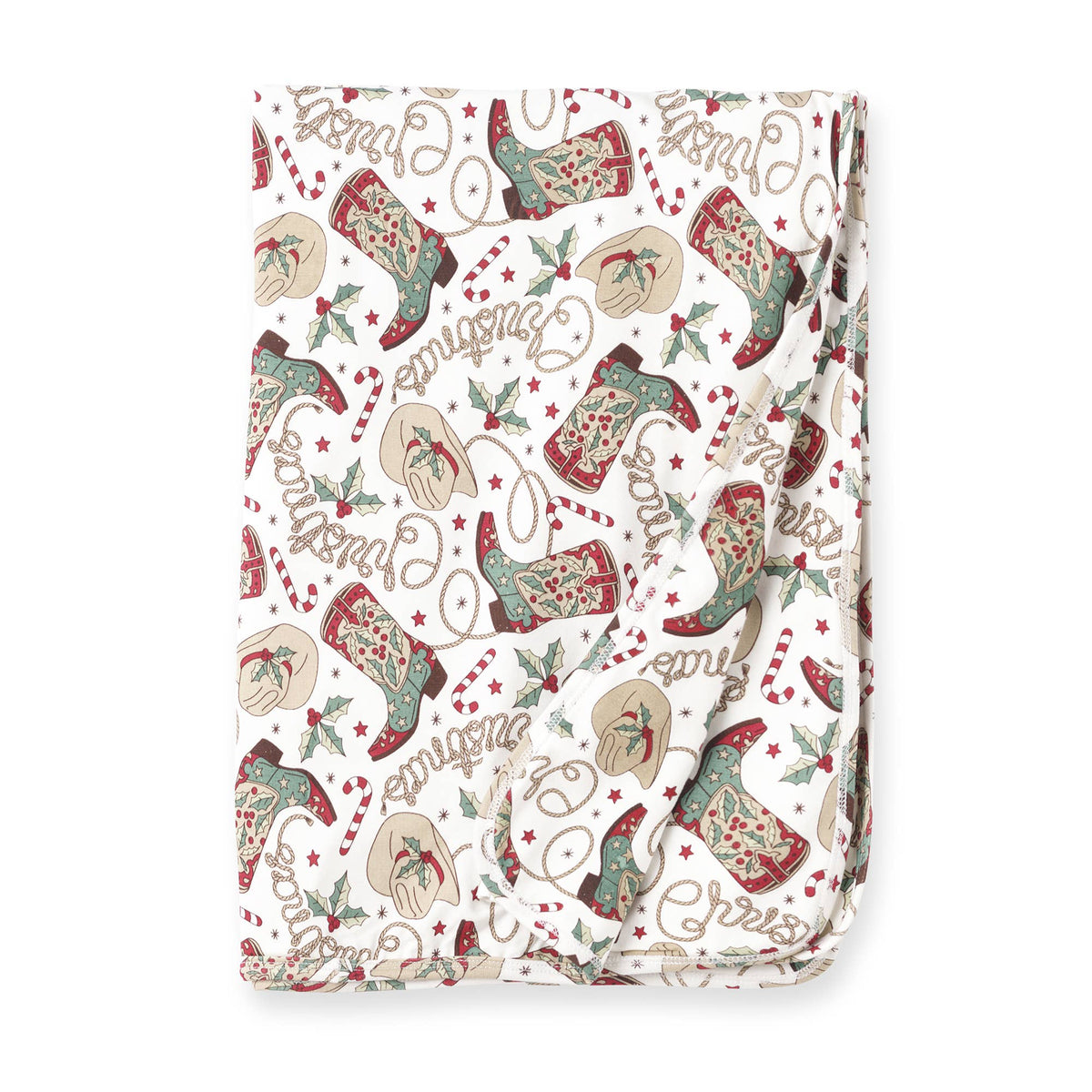A folded Christmas-themed baby bamboo stroller blanket with a pattern of boots, berries, and holiday greetings on a white background.