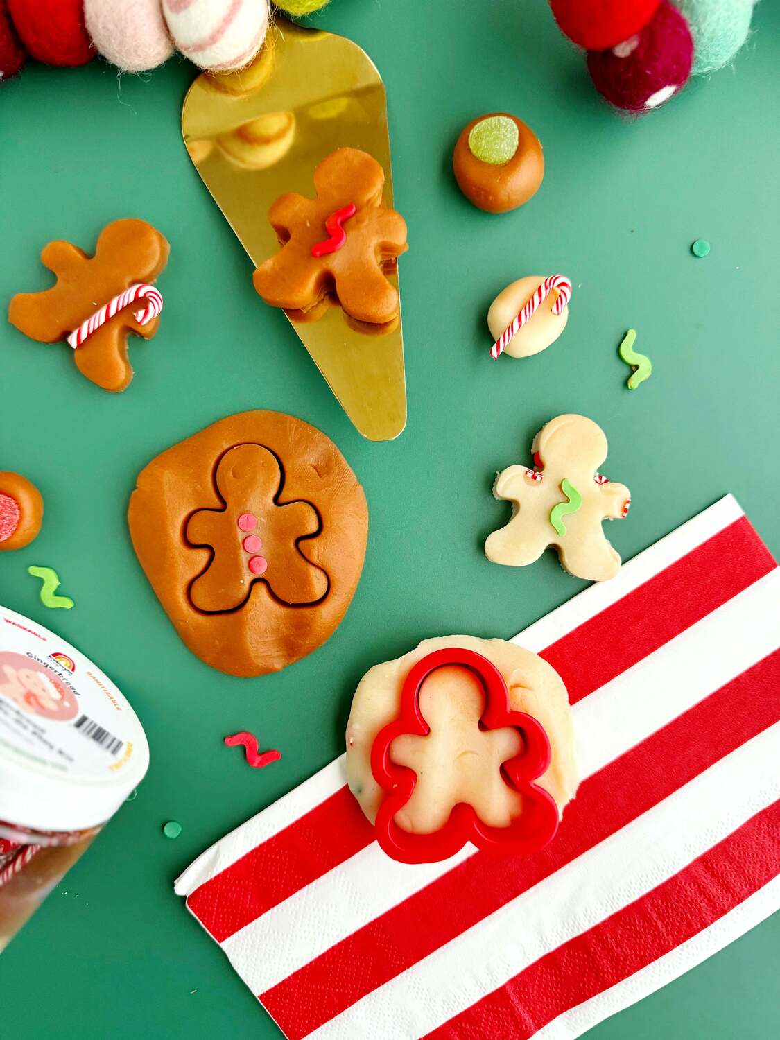 Decorative scene with gingerbread-themed items on a green background