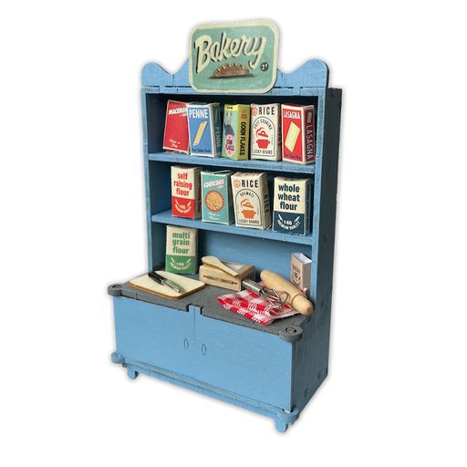Toy bakery display with shelves and a 'Bakery' sign on a white background