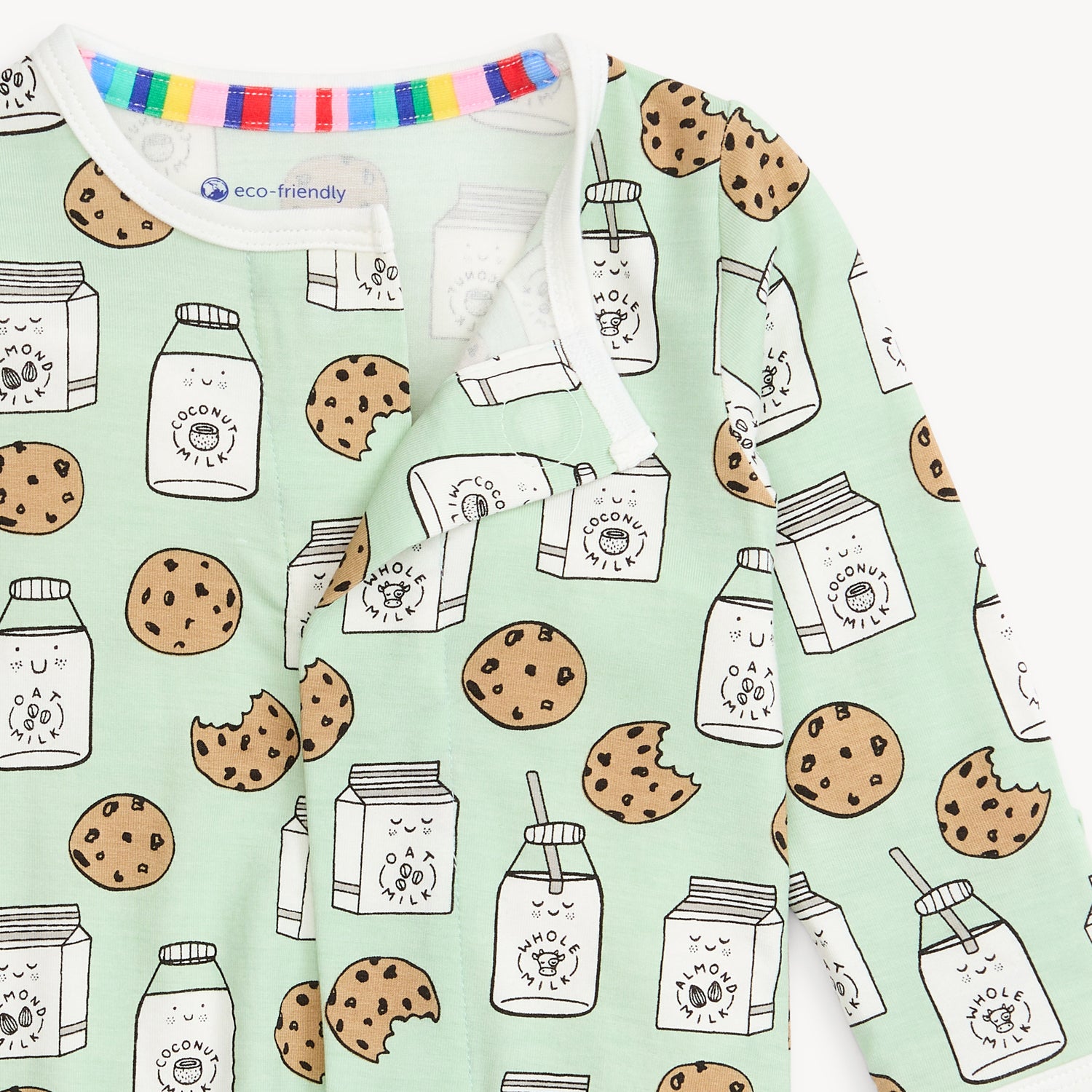 baby footie with cookie and milk pattern on a light green background