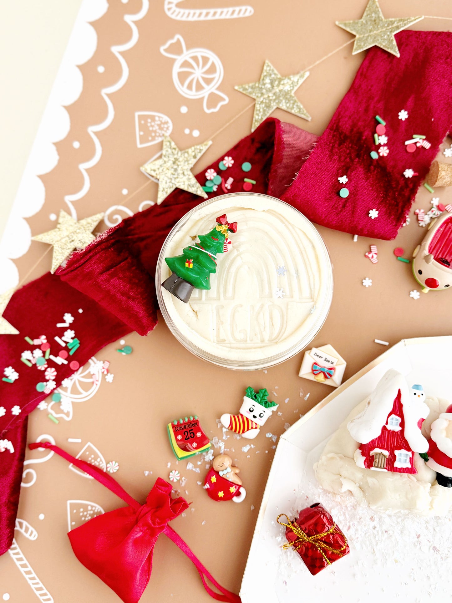 Decorative Christmas scene with a hot chocolate drink, cookies, and festive elements on a brown background.