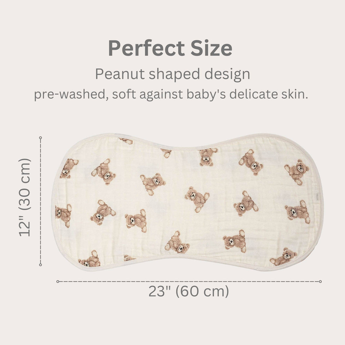 Peanut-shaped baby burp cloth with teddy bear pattern and measurements on a white background